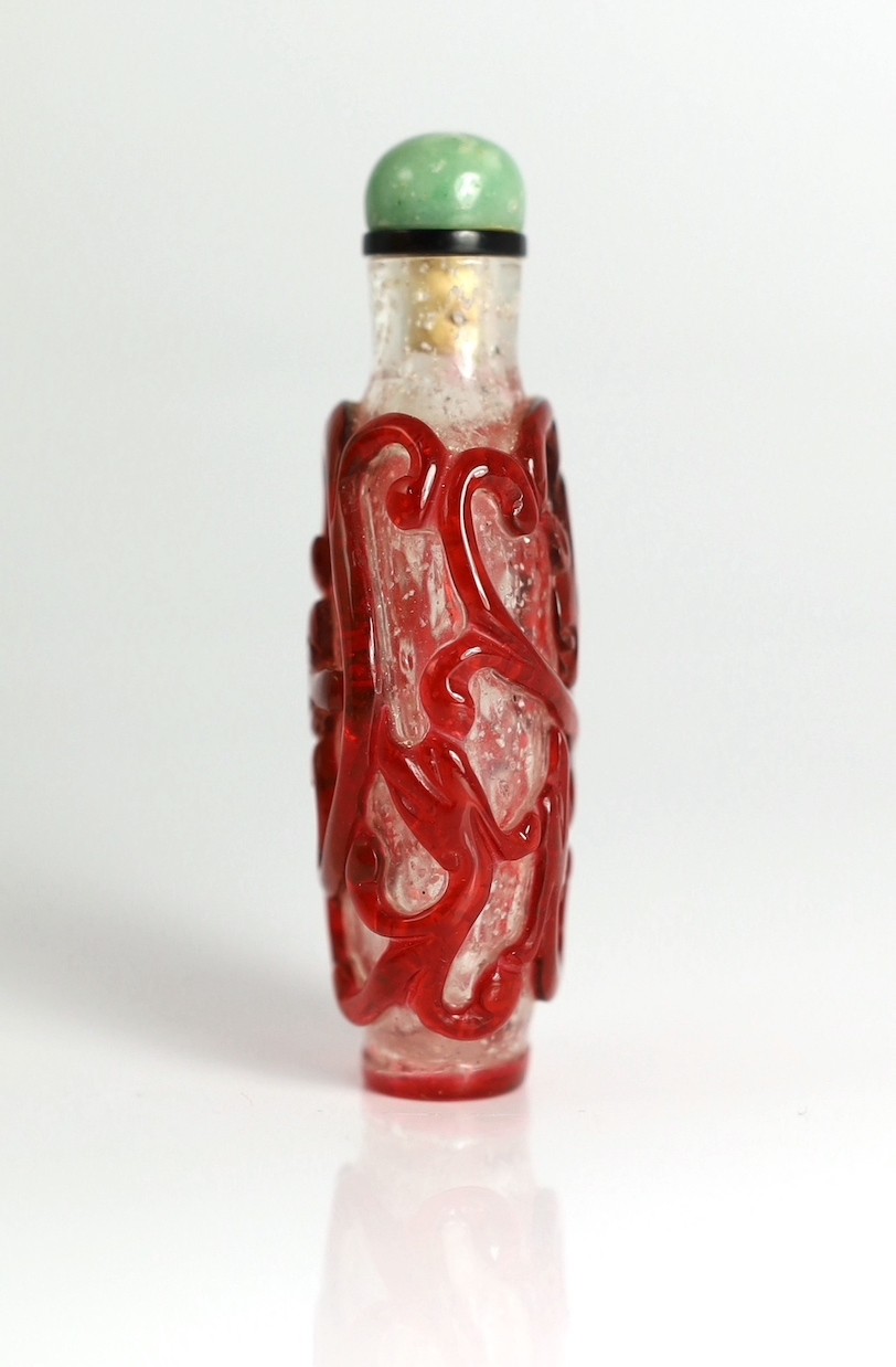 A Chinese ruby red overlay on snowflake ground snuff, 1750-1850, 7.4cm high